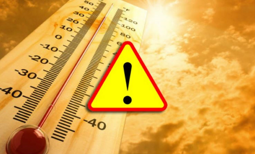 Wysoka temperatura na termometrze, na tle przebijającego słońca